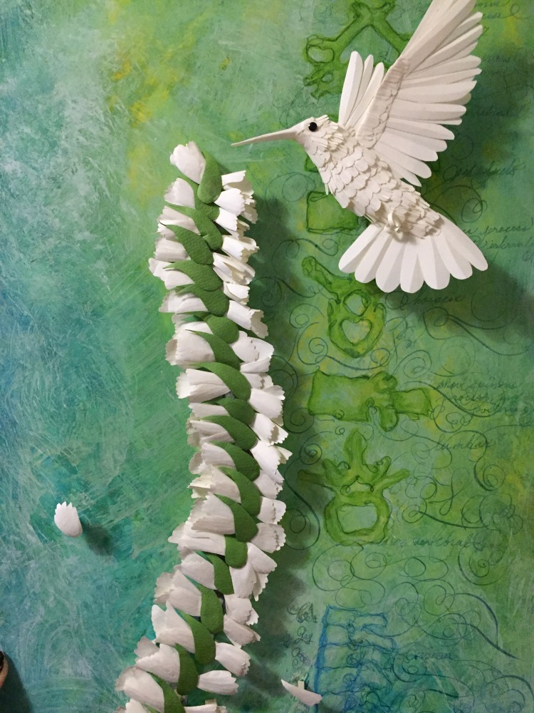 Paper hummingbird with flower spinal cord